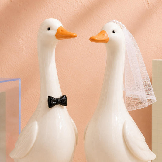 Ceramic goose groom with black bow tie and bride with white veil
