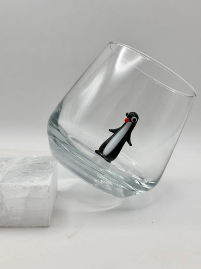 Penguin figurine stemless tumbler in a styled drinkware setting