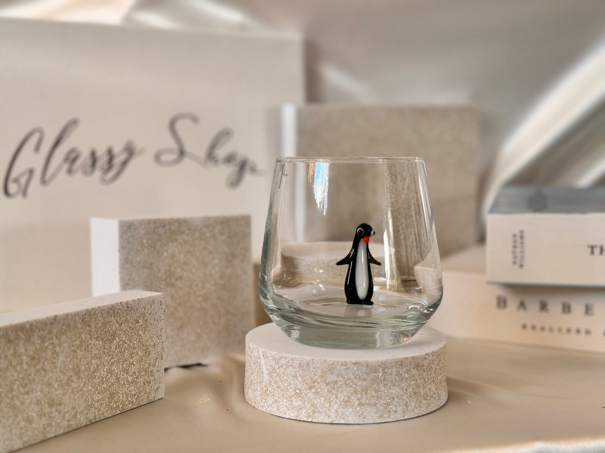 Clear handmade glass with playful penguin character detail