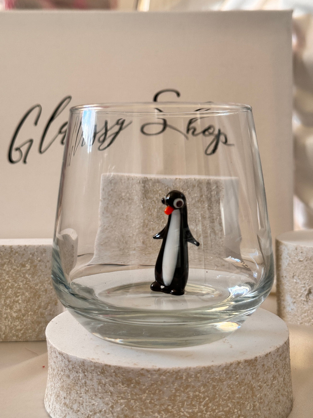 Penguin lover gift glass photographed from the side