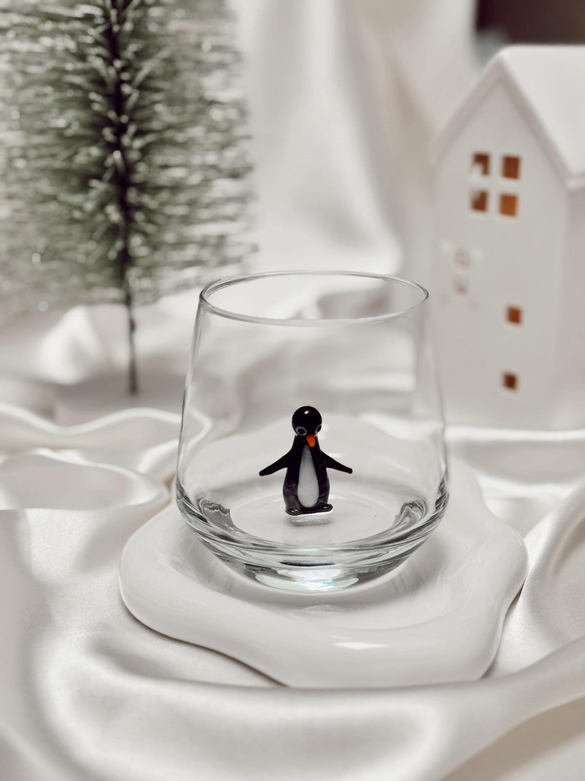 Handmade penguin figurine glass shown from a second angle