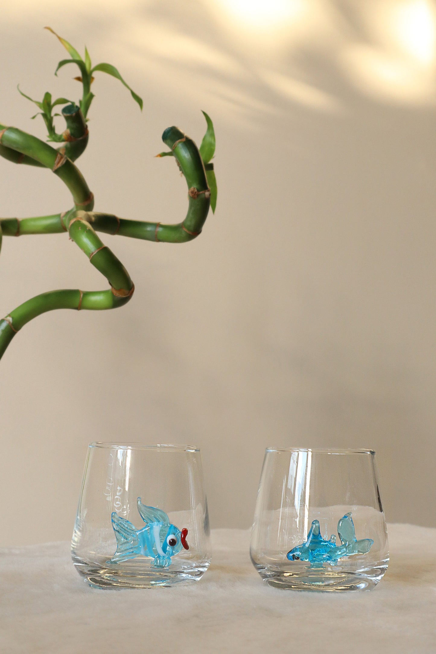 Blue starfish figurine inside a handmade shot glass
