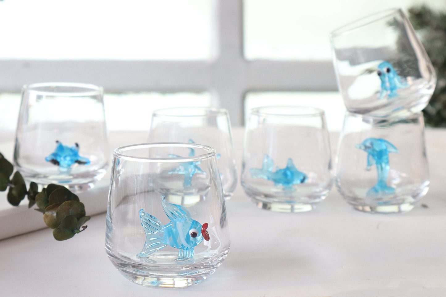 Colorful fish figurine inside a handmade glass