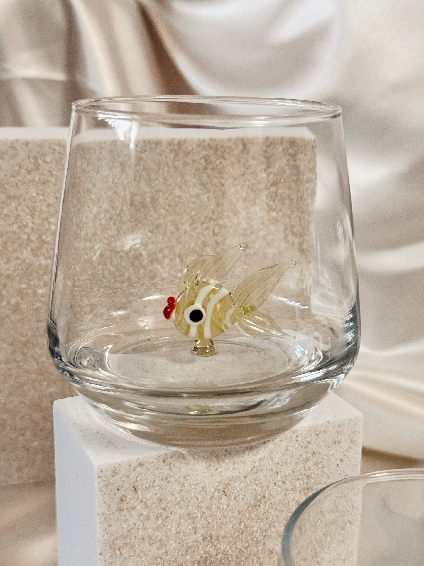Handmade fish figurine glass photographed from the side