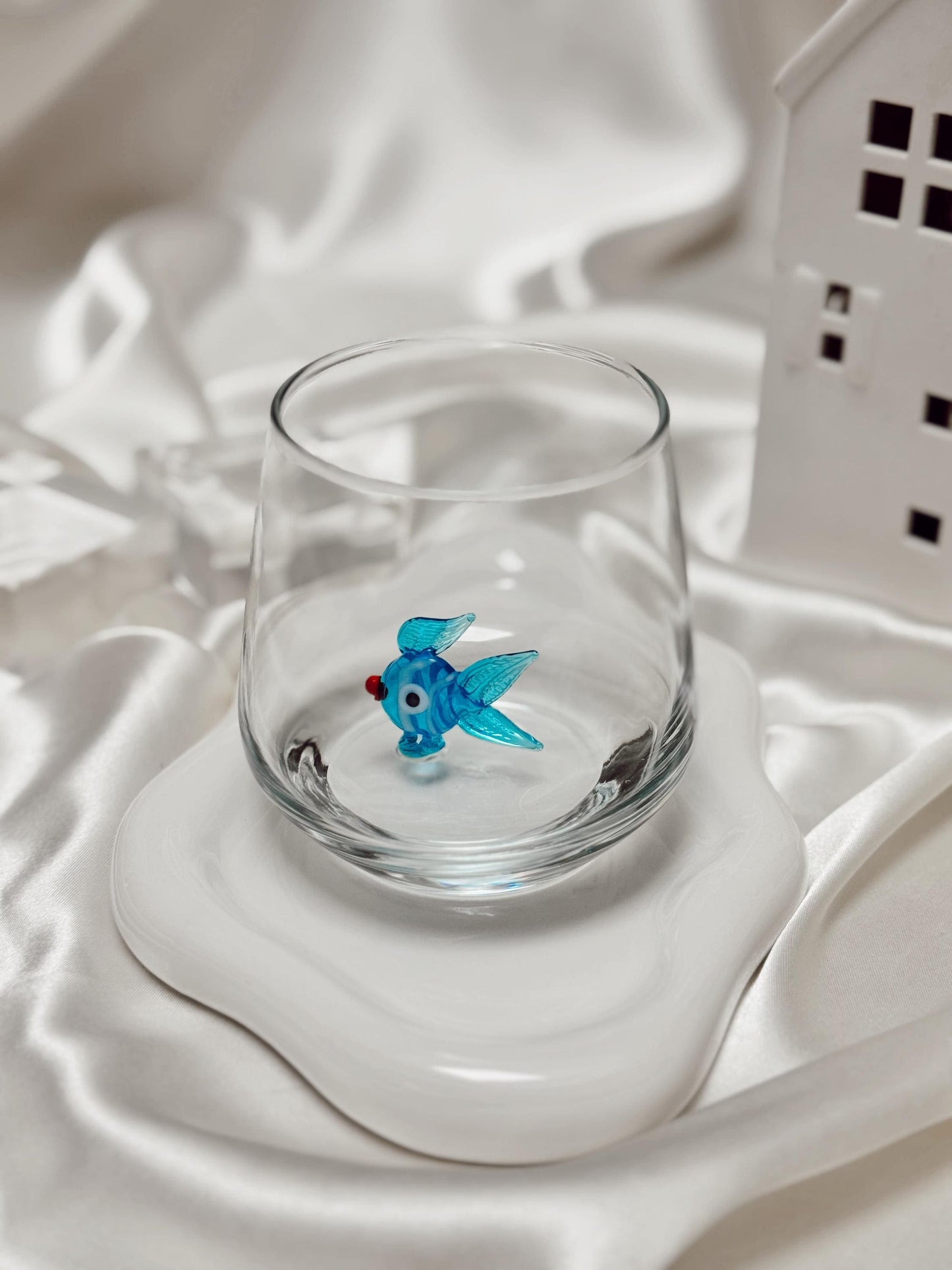 Colorful fish Murano-style glass shown as an ocean lover gift