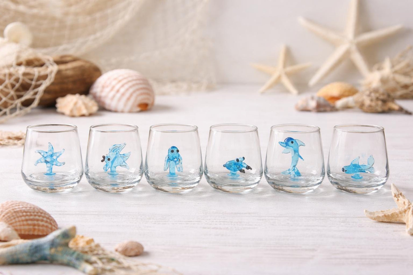 Handmade sea animal shot glasses displayed as an ocean barware set