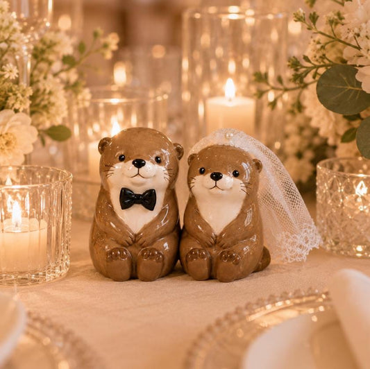 Ceramic otter bride and groom wedding cake topper figurines