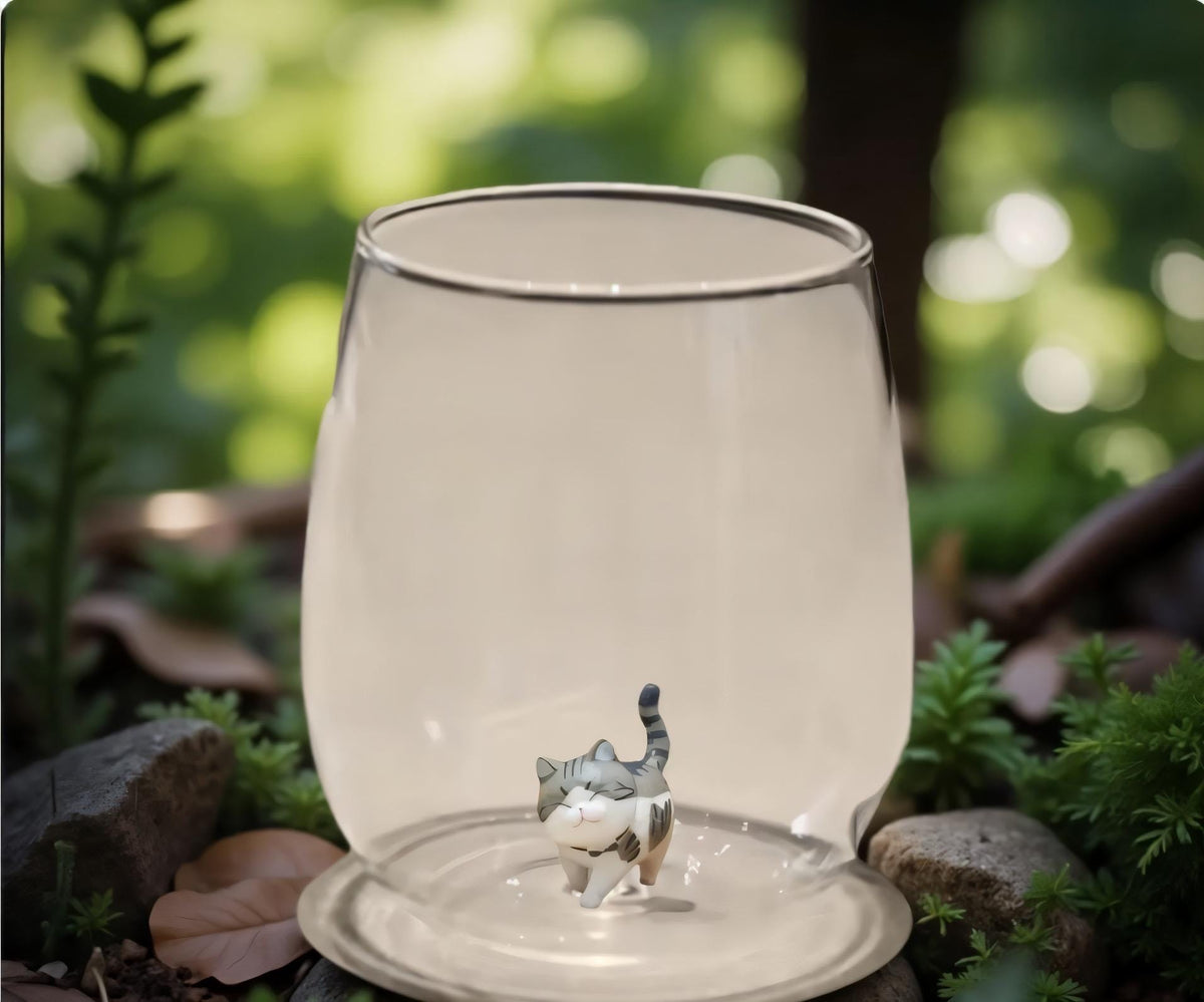 Four available hand-formed cat figurine glass designs together