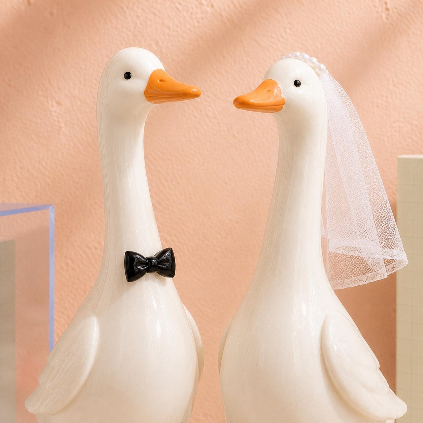 Ceramic goose groom with black bow tie and bride with white veil
