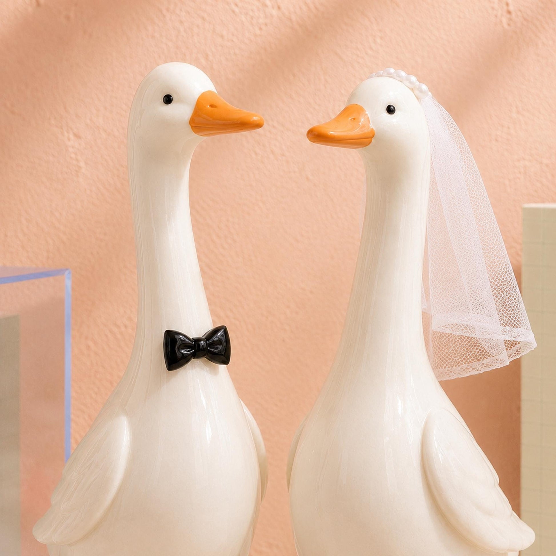Ceramic goose groom with black bow tie and bride with white veil