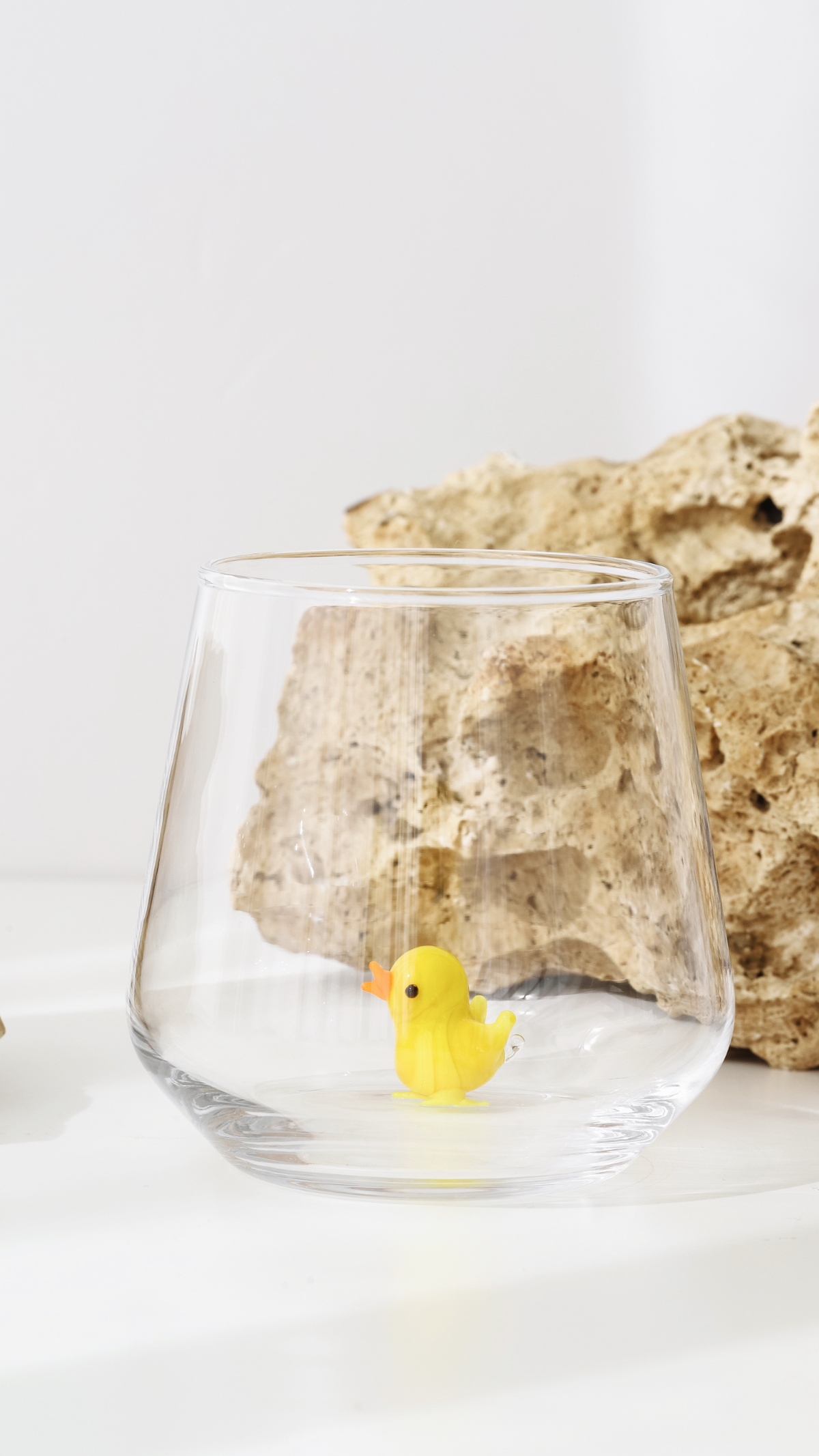 Cute chick figurine drinking glass displayed as handmade giftware
