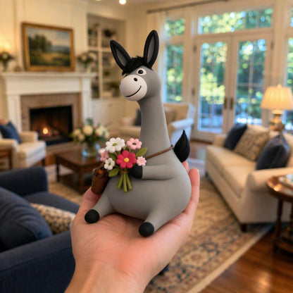 Handmade clay donkey holding flowers — image 1