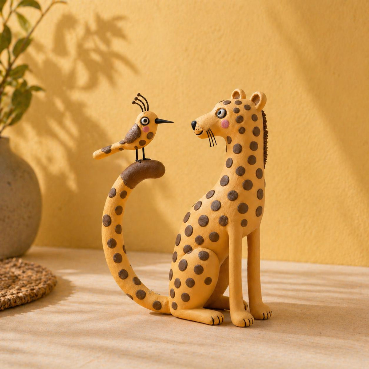 Handmade leopard and bird clay figurine