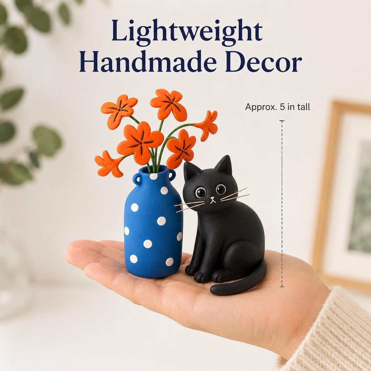 Handmade black cat with blue polka-dot vase and orange clay flowers