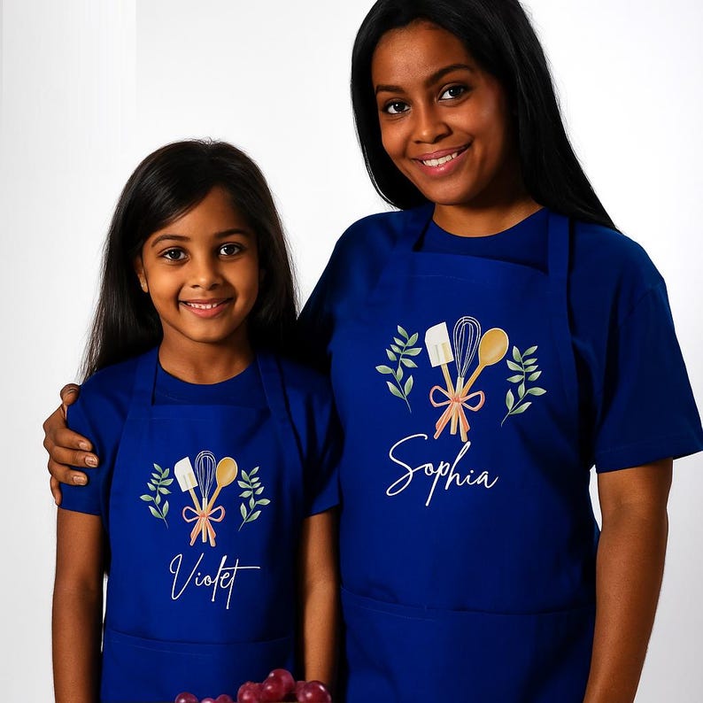 Matching navy personalized aprons for an adult and child