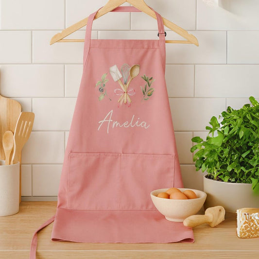 Personalized pink apron with Amelia name and watercolor kitchen utensils